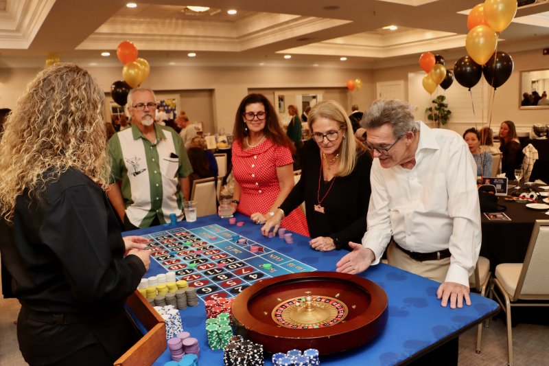 Hoping their lucky number comes up on the roulette wheel at Humane Animal Partners’ Casino Night fundraiser are (l-r) Tom Donovan, Renata Andreani, Karen Morgan and John Morgan. BILL SHULL PHOTOS